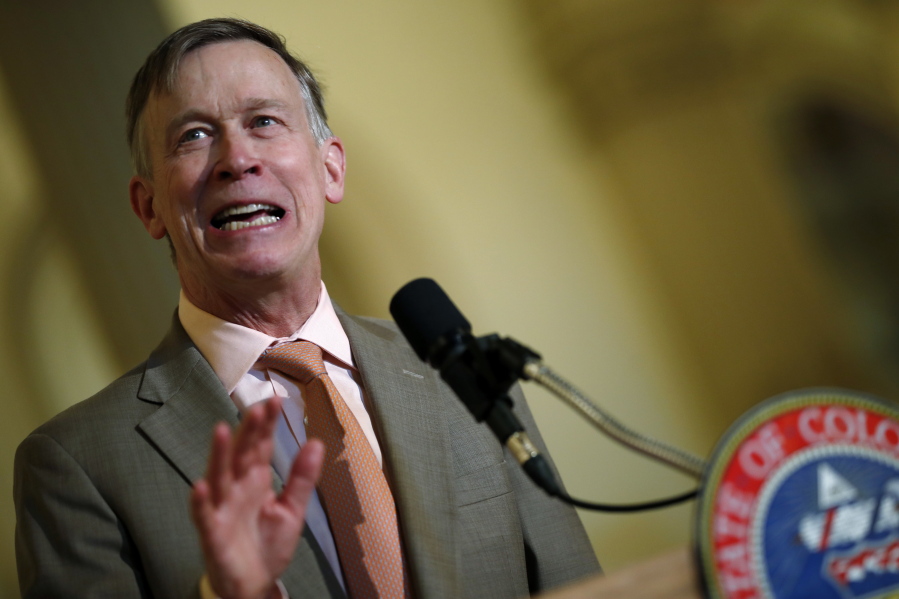 In this May 30,2018 file photo Colorado Gov. John Hickenlooper speaks at the state Capitol. On Tuesday, June 19, 2018, Hickenlooper ordered state regulators to adopt California’s vehicle pollution rules, joining other states in resisting the Trump administration’s plans to ease up on emissions standards. Hickenlooper, a Democrat, told regulators to try to have the new vehicle standards in place by the end of the year.