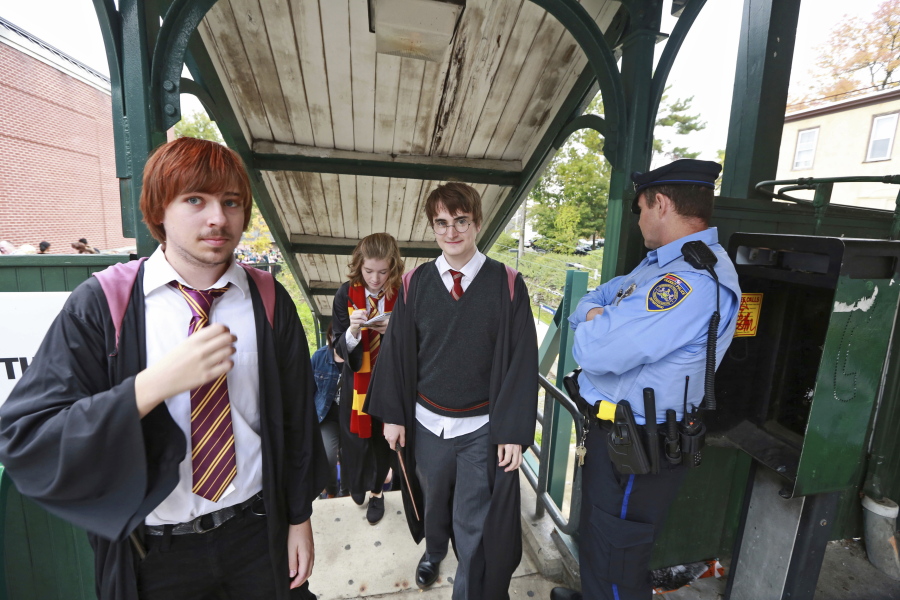 Students from Chestnut Hill College in Philadelphia wear Harry Potter costumes to a 2014 festival based on the fantasy series by British author J.K. Rowling.