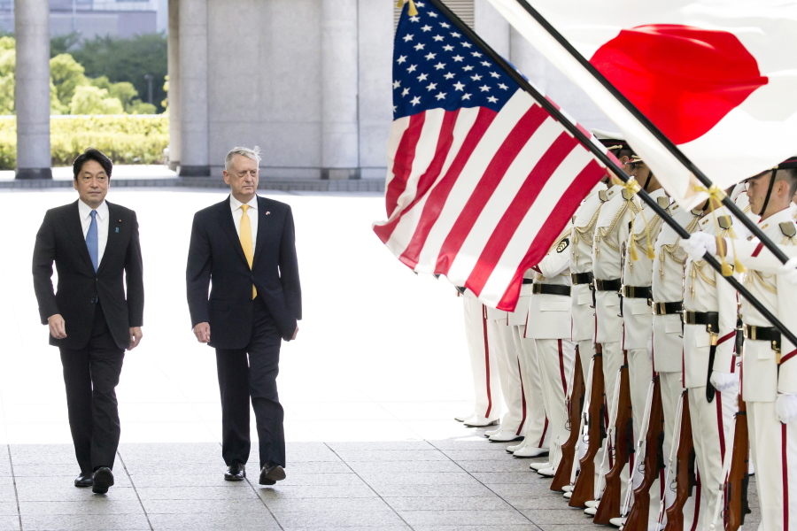 U.S. Defense Secretary Jim Mattis, second from left, with Japanese Defense Minister Itsunori Onodera reviews an honor guard before their meeting at Defense Ministry in Tokyo on Friday.