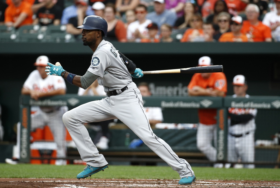 Seattle Mariners’ Dee Gordon singles in the second inning of a baseball game against the Baltimore Orioles, Monday, June 25, 2018, in Baltimore. Denard Span and Chris Herrmann scored on the play.