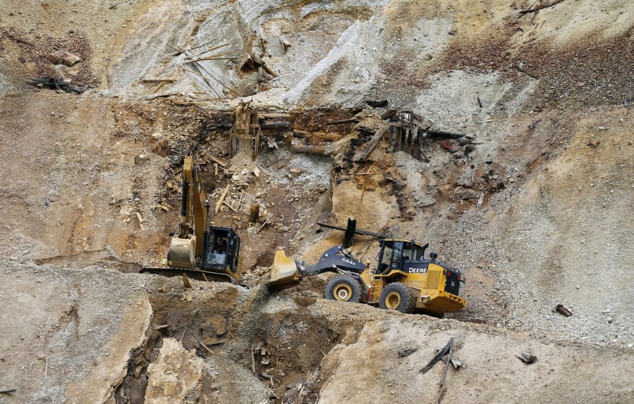 Environmental Protection Agency contractors repair damage at the site of the Gold King mine spill of toxic wastewater outside Silverton, Colo., on Aug. 12, 2015. The Gold King and other mines in the area are now part of a Superfund cleanup project. The U.S. Environmental Protection Agency announced Thursday, June 14, 2018, it plans to take a series of interim cleanup steps at some of the sites while it searches for a longer-term solution.