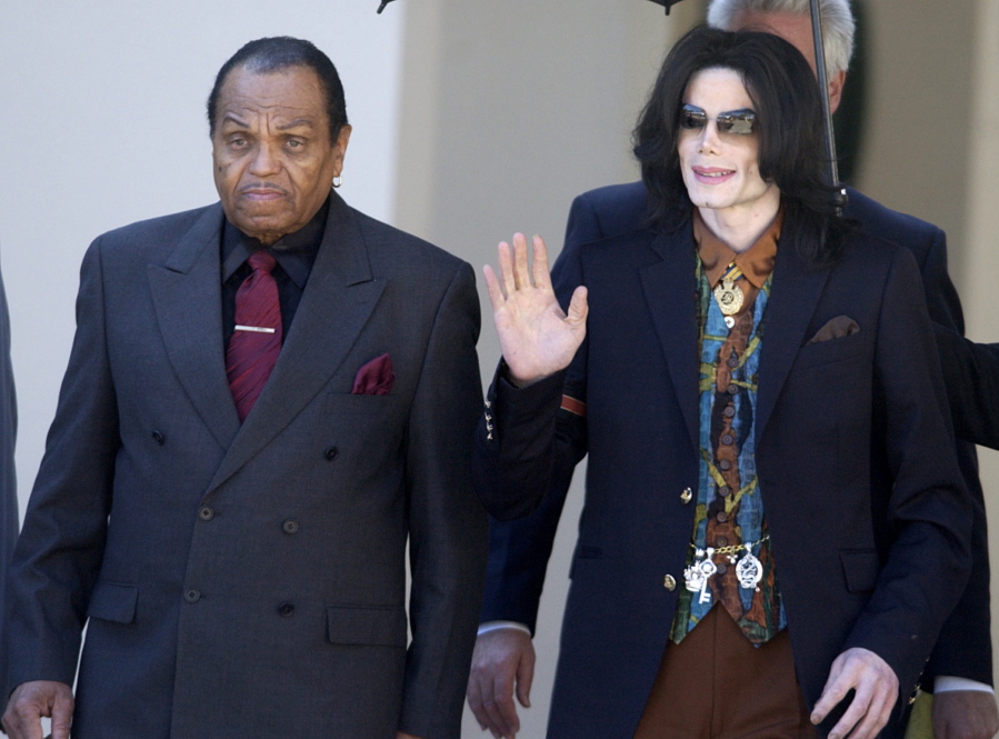 Pop star Michael Jackson leaves March 15, 2005 the Santa Barbara County Courthouse with his father, Joe, in Santa Maria, Calif., following a day of testimony in Jackson’s trial on charges of child molestation. Joe Jackson died on Wednesday.