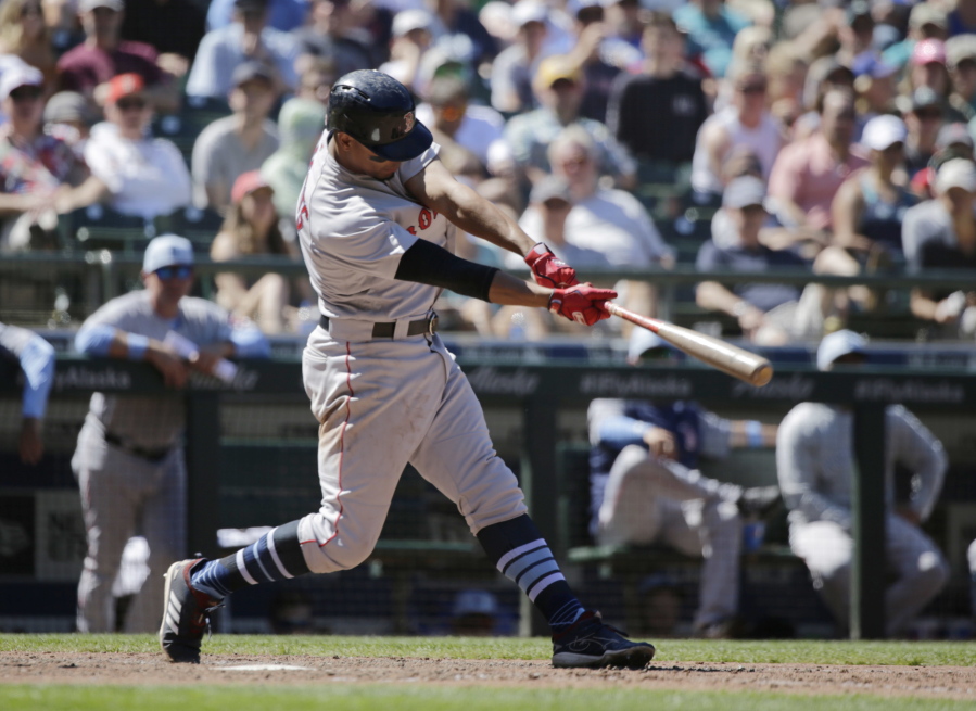 Boston Red Sox’s Xander Bogaerts hits a two-run home run on a pitch from Seattle Mariners’ Chasen Bradford during the seventh inning of a baseball game, Sunday, June 17, 2018, in Seattle.