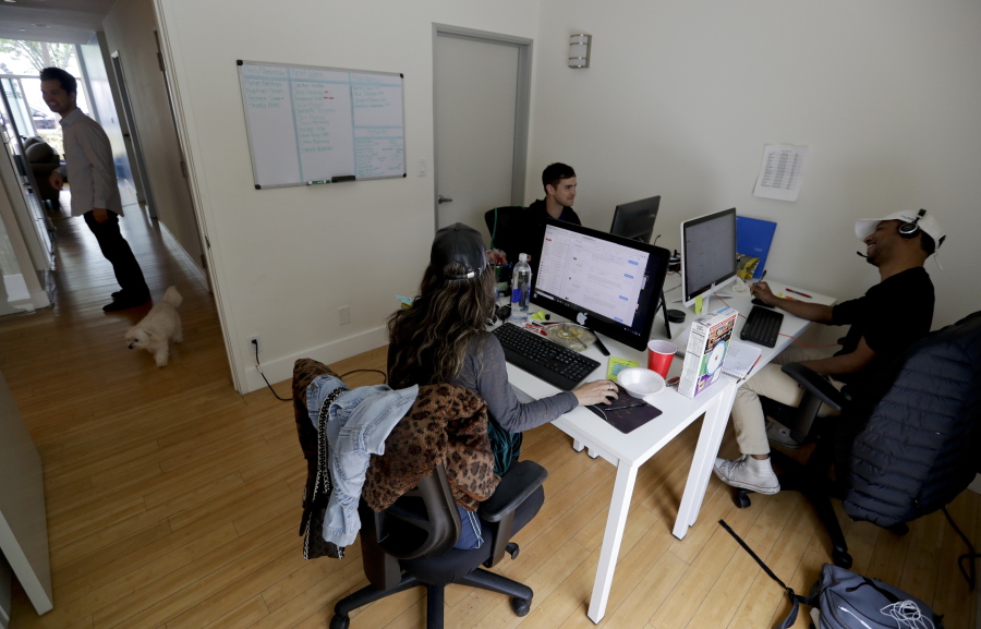 People work in the offices of HeyTutor, an online company that matches tutors with students in Los Angeles.