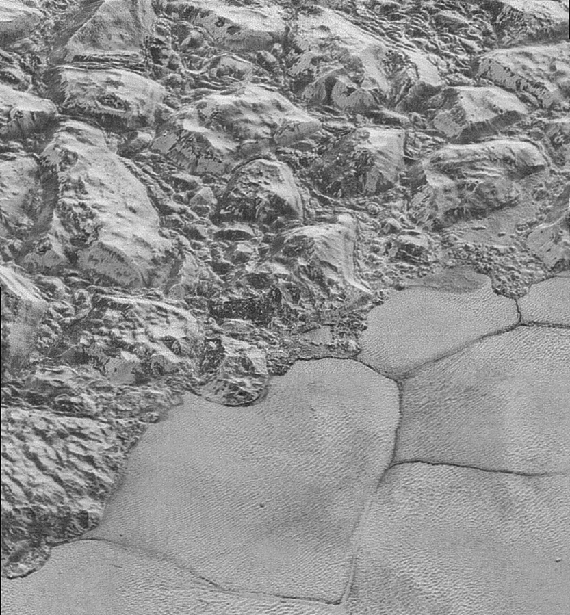 The New Horizons spacecraft photographed dunes, small ripples at bottom right, on Pluto’s Sputnik Planitia ice plain. At upper left are a series of mountains.