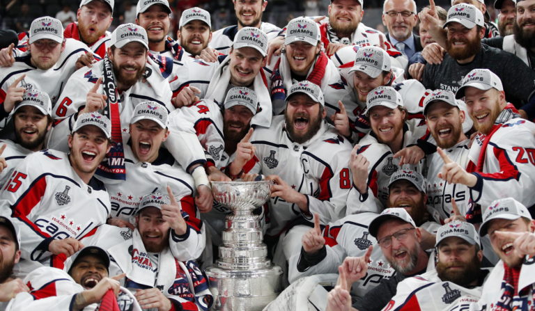 Members of the Washington Capitals pose with the Stanley Cup after the Capitals defeated the Golden Knights 4-3 in Game 5 of the NHL hockey Stanley Cup Finals Thursday, June 7, 2018, in Las Vegas.