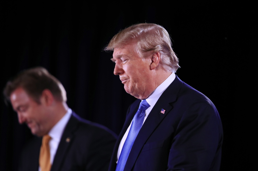 President Donald Trump with Sen. Dean Heller, R-Nev., speaks at a Nevada GOP Convention in Suncoast Hotel and Casino in Las Vegas, Saturday, June 23, 2018.