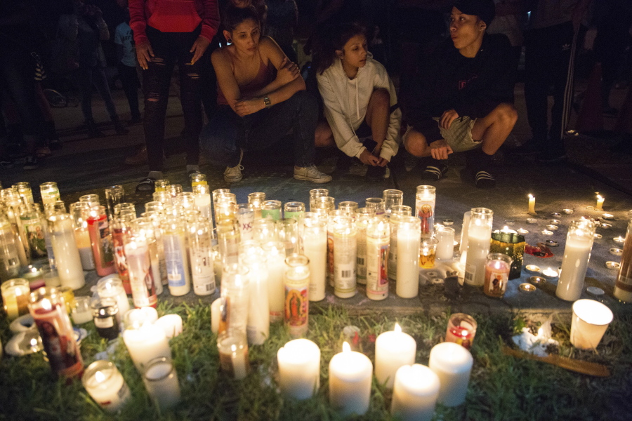 Fans and community members gather at the vigil Tuesday for rap singer XXXTentacion in Deerfield Beach, Fla., near the site where the troubled rapper-singer was killed the day before. The 20-year-old rising star, whose real name is Jahseh Dwayne Onfroy, was shot outside the motorcycle dealership on Monday when two armed suspects approached him, authorities said.