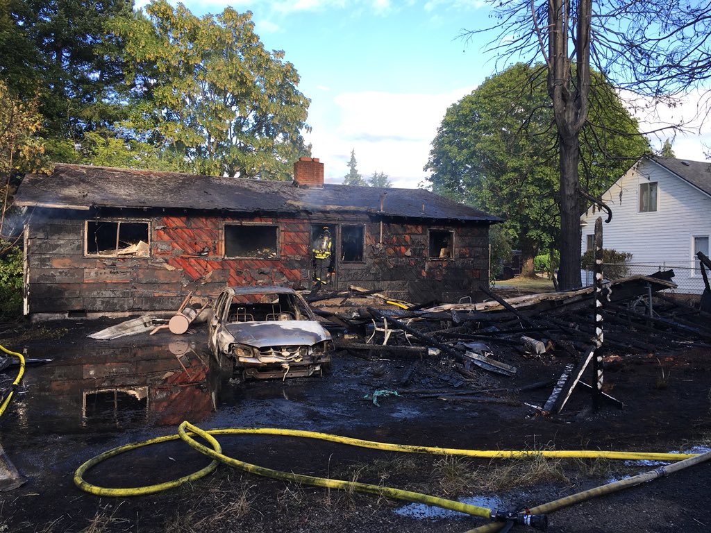 This house and car were destroyed by a fast-moving fire Thursday evening in Vancouver's Rose Village neighborhood.