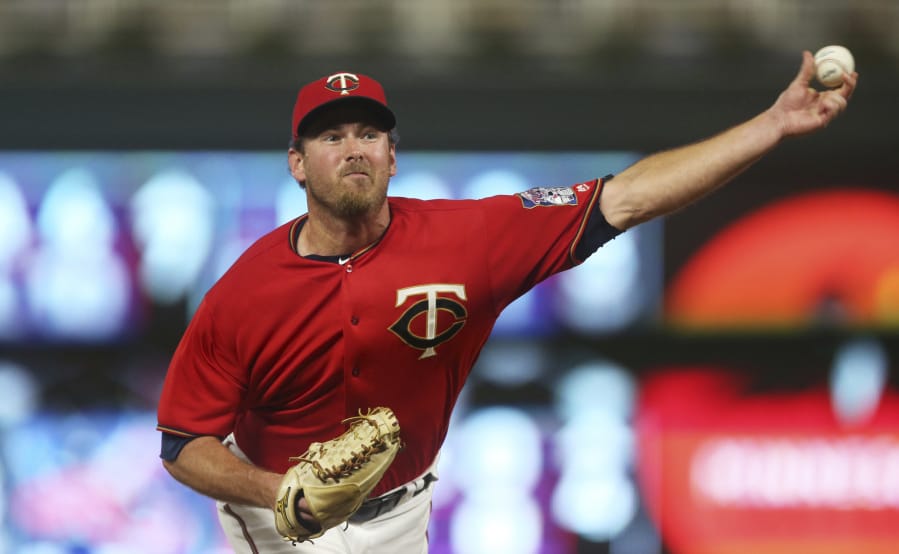 Minnesota Twins pitcher Zach Duke throws against the Tampa Bay Rays in a baseball game Friday, July 13, 2018, in Minneapolis.(AP Photo/Jim Mone)