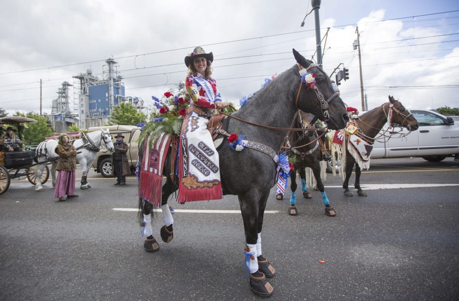 Miss Vancouver Rodeo, Shyanne Chandler, with her horse Blue at the Portland Rose Festival Grand Floral Parade in Portland in early June.