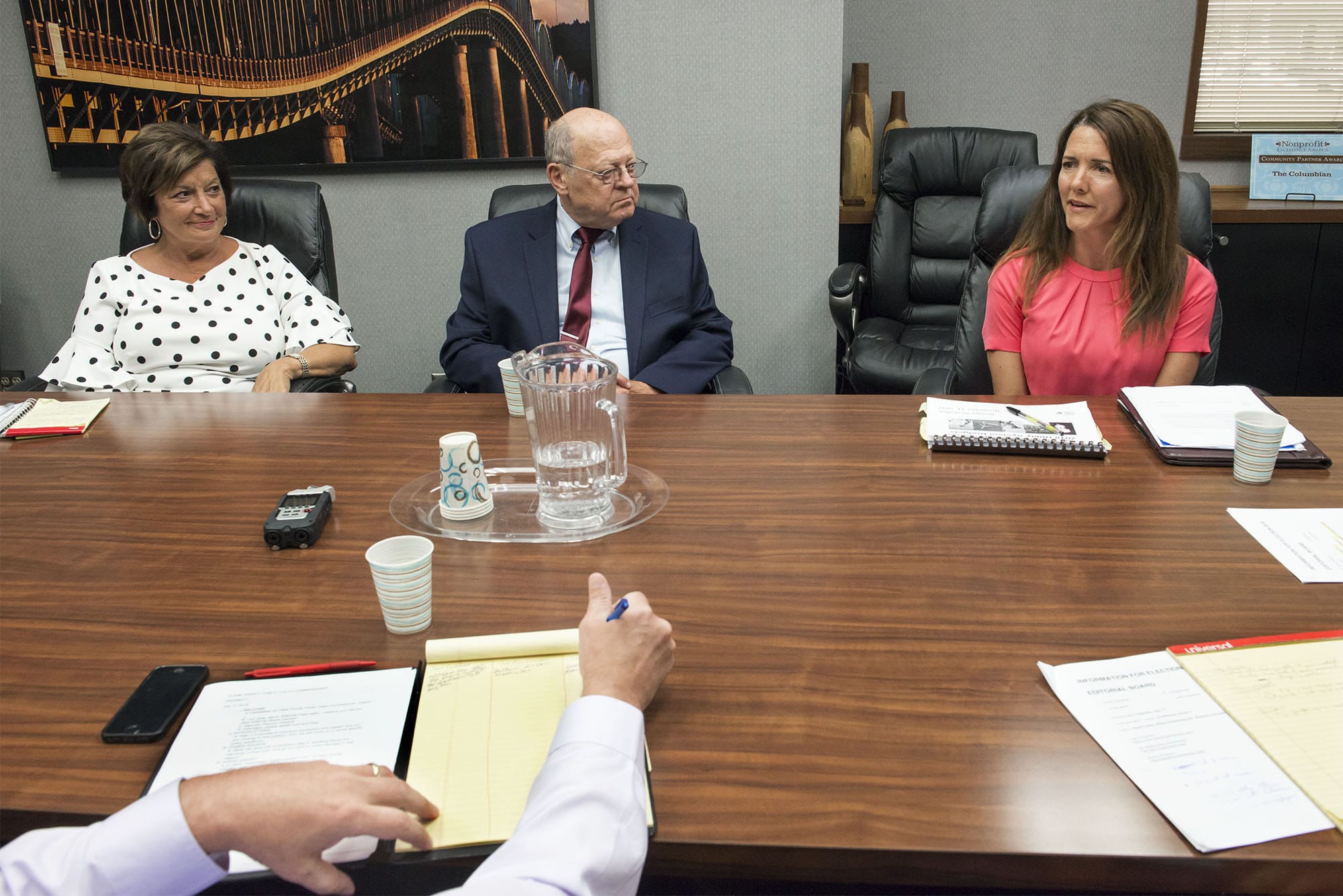 Judy Chipman, from left,  Jim Malinowski, and Sherry Erickson, candidates for Clark Public Utility commissioner District 1,  speak with The Columbian Editorial Board on Tuesday afternoon.