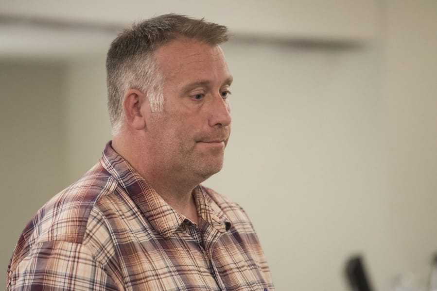 Michael J. Brotherton, a teacher placed on leave from Laurin Middle School after being charged with assaulting his wife, appears Thursday in Clark County Superior Court, following allegations that he stalked the woman in Seattle.