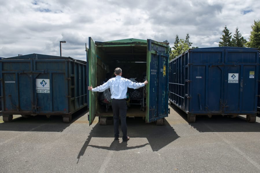 Operations Superintendent Ryan Miles with Vancouver Public Works opens a container rented from Waste Connections that is used to store items collected from homeless camps around the city. The containers are kept on city-owned property in west Vancouver.