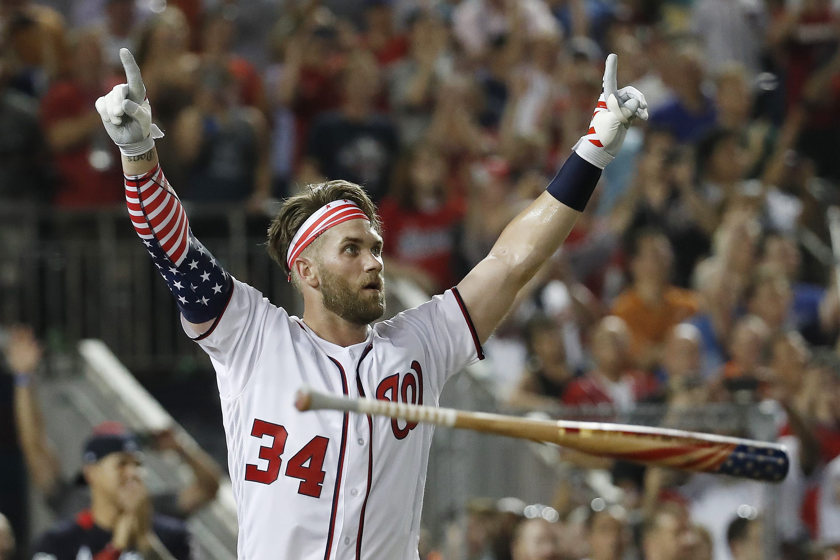 Washington Nationals Bryce Harper (34) reacts to his winning hit during the Major League Baseball Home Run Derby, Monday, July 16, 2018 in Washington.