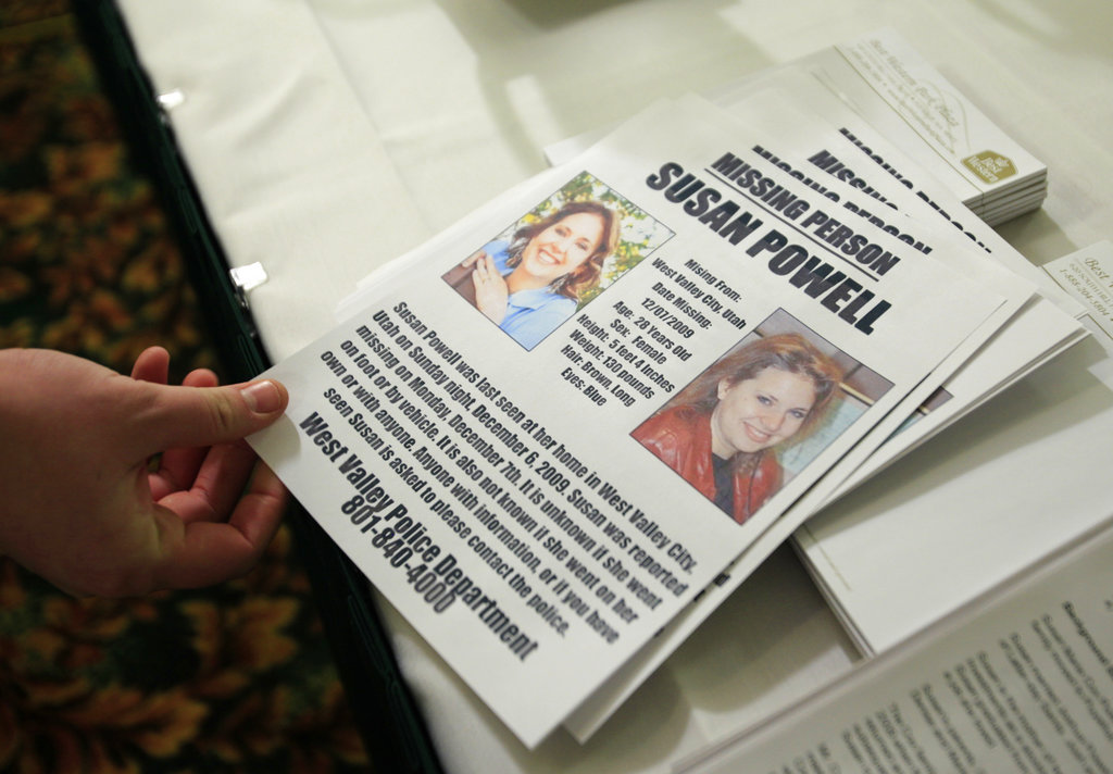 FILE - In this Dec. 17, 2009 file photo, a flier seeking information on the whereabouts of Susan Powell, who was reported missing in Utah, is shown at a press conference in Puyallup, Wash. Authorities in Washington state say the father-in-law of the long-missing Utah woman Susan Powell has died, leaving all three family members suspected in her disappearance now dead themselves. The Pierce County Sheriff's Department said Steven Powell died Monday at St. Joseph's Hospital in Tacoma, a year after he completed his sentence for possession of child pornography. (AP Photo/Ted S.