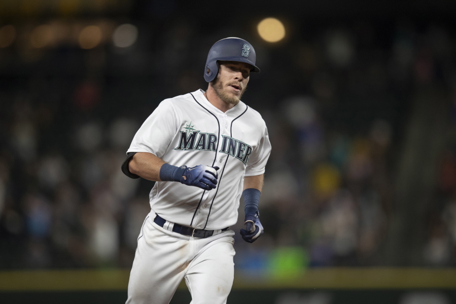 Seattle Mariners’ Chris Herrmann runs the bases after hitting a solo home run off Los Angeles Angels relief pitcher Miguel Almonte during the seventh inning of a baseball game Thursday, July 5, 2018, in Seattle.