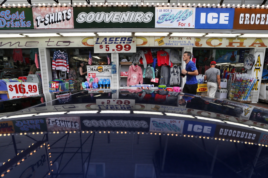 A souvenir shop attracts tourists in Old Orchard, Beach, Maine, on July 6. In Old Orchard Beach, popular with Canadians from French-speaking Quebec, innkeepers report that tourism remains strong despite harsh words. (Robert F.