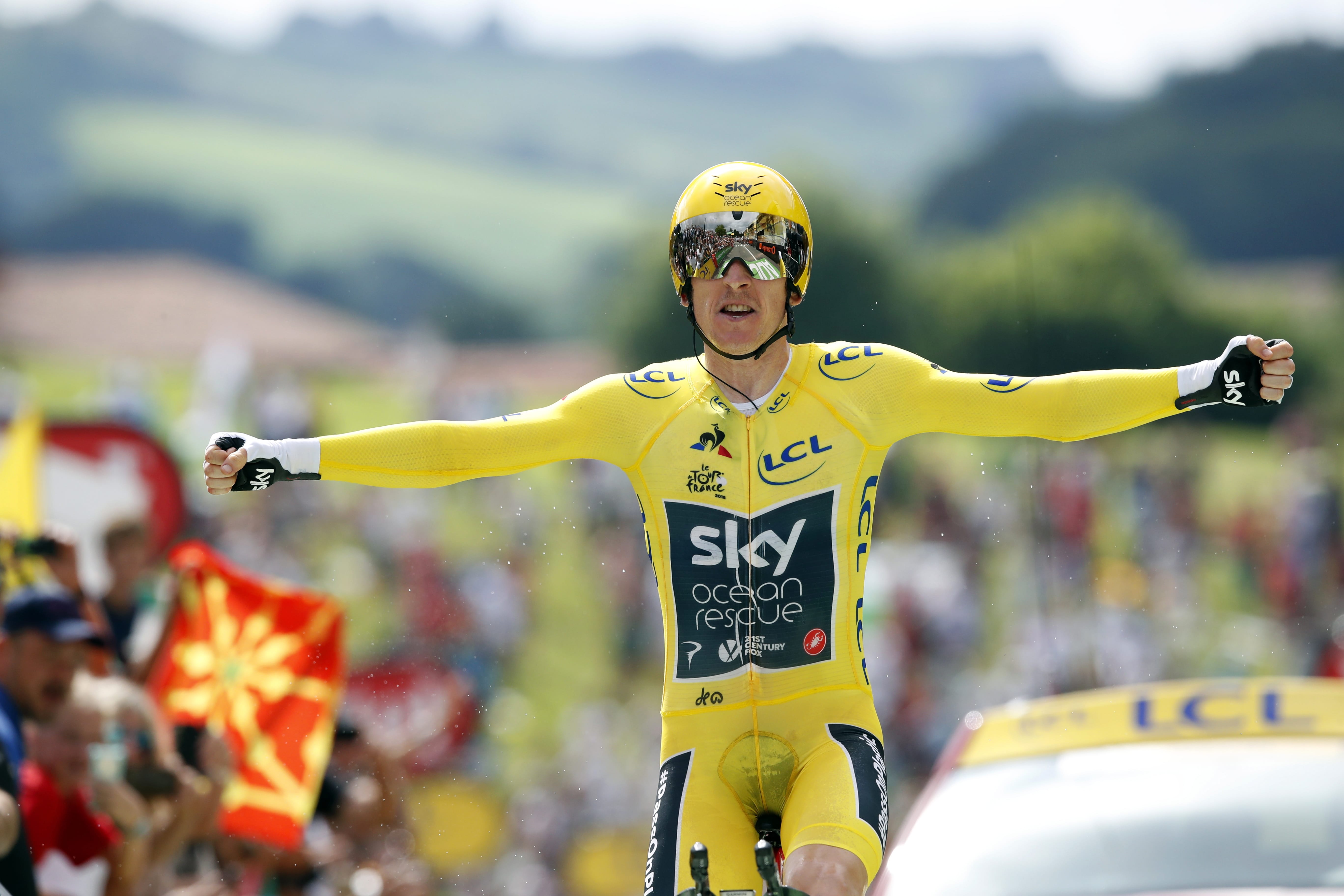 Britain's Geraint Thomas, wearing the overall leader's yellow jersey reacts as he crosses the finish line during the twentieth stage of the Tour de France cycling race, an individual time trial over 31 kilometers (19.3 miles) with start in Saint-Pee-sur-Nivelle and finish in Espelette, France, Saturday, July 28, 2018.