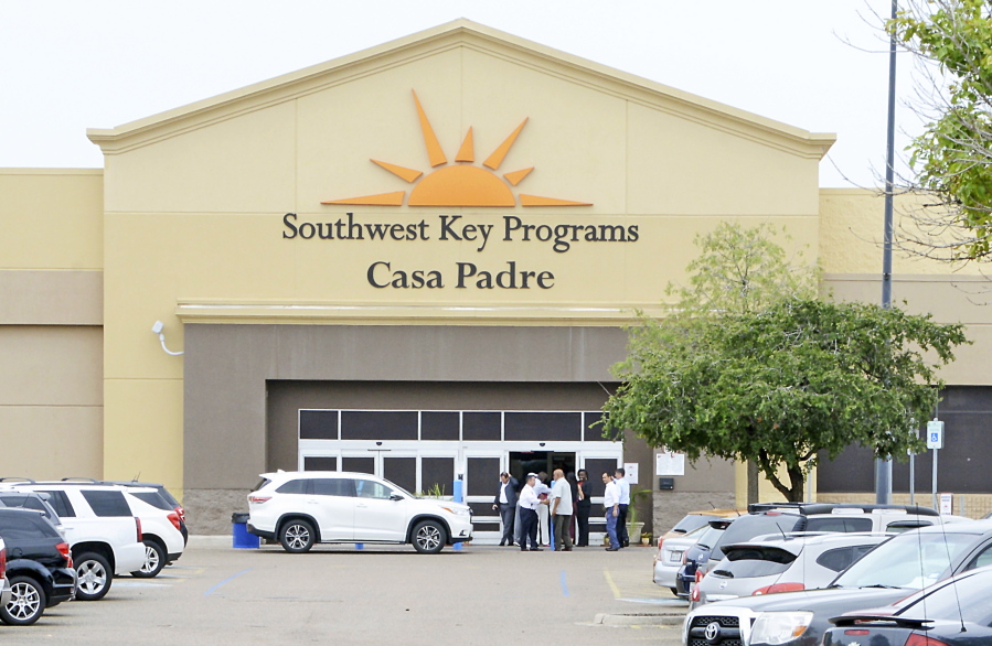 FILE - In this June 18, 2018 file photo, dignitaries take a tour of Southwest Key Programs Casa Padre, a U.S. immigration facility in Brownsville, Texas, where children who have been separated from their families are detained. The American Civil Liberties Union says it appears the Trump administration will miss a Tuesday, July 10 deadline to reunite young children with their parents in more than half of the cases. The group said the administration provided it with a list of 102 children under 5 years old who must be reunited by Tuesday under an order by U.S. District Judge Dana Sabraw in San Diego. It said in a statement that it “appears likely that less than half will be reunited” by that deadline.