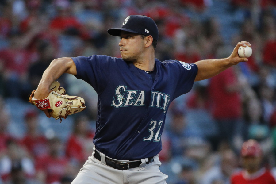 Seattle Mariners starting pitcher Marco Gonzales throws to a Los Angeles Angels batter during the first inning of a baseball game Wednesday, July 11, 2018, in Anaheim, Calif. (AP Photo/Jae C.