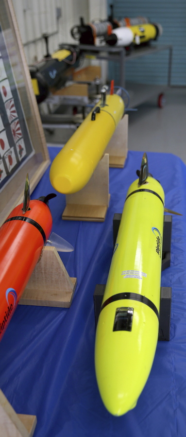 Small U.S. Navy unmanned undersea drones are displayed June 28 at Naval Base Kitsap in Bremerton.