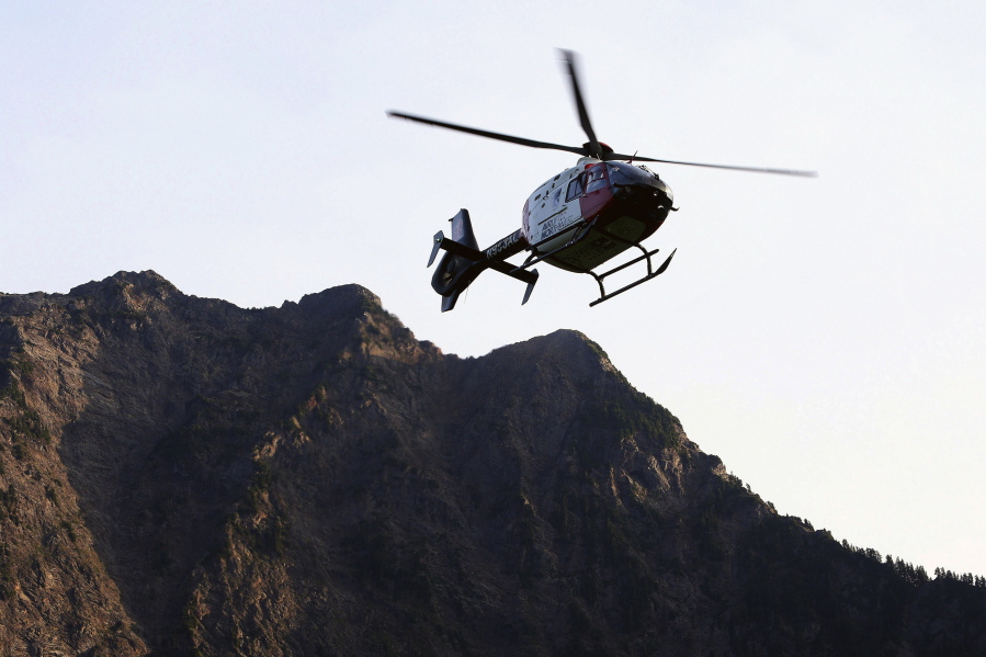 A helicopter transports an injured woman to a hospital July 6, 2015, near the Big Four trailhead in Verlot. Air ambulances transport around 400,000 people each year in the U.S., according to industry estimates.