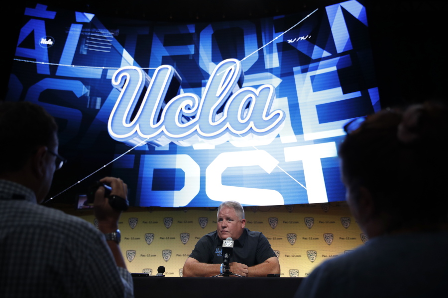 UCLA coach Chip Kelly talks to reporters at the Pac-12 Conference NCAA college football media day in Los Angeles, Wednesday, July 25, 2018. (AP Photo/Jae C.