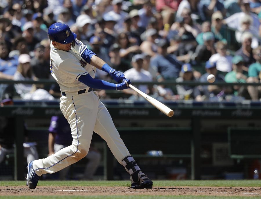 Seattle Mariners’ Ryon Healy hits a three-run home run against the Colorado Rockies during the sixth inning of a baseball game, Sunday, July 8, 2018, in Seattle. (AP Photo/Ted S.