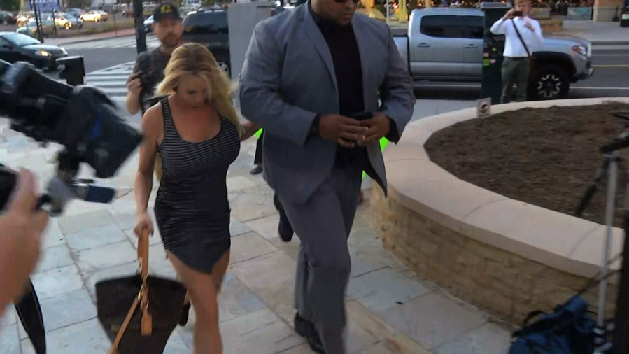 In this image from video, Stormy Daniels arrives at the strip club Cloakroom for a performance Monday in Washington.