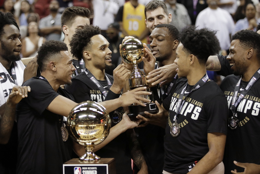 The Portland Trail Blazers celebrate after defeating the Los Angeles Lakers in an NBA summer league championship basketball game, Tuesday, July 17, 2018, in Las Vegas.