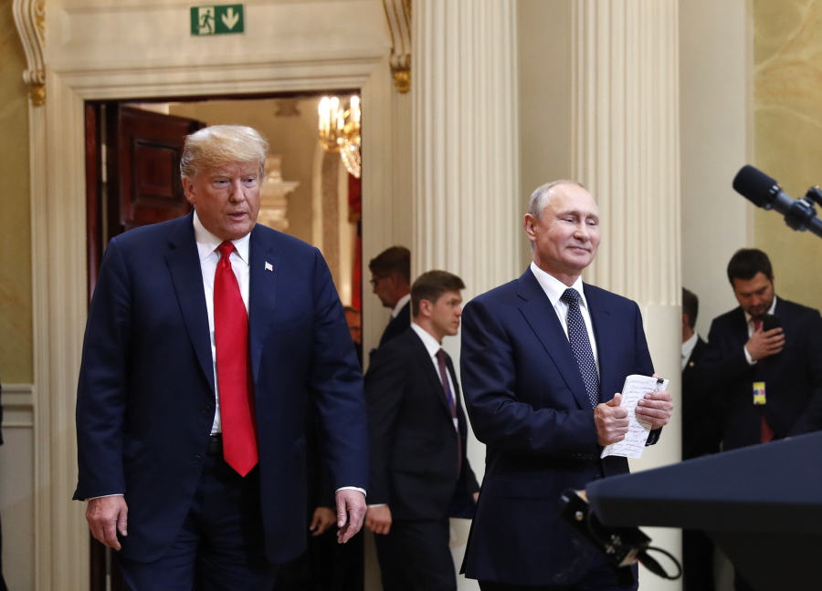 In this July 16, 20198, photo, U.S. President Donald Trump, left, and Russian President Vladimir Putin arrive for a news conference at the Presidential Palace in Helsinki, Finland. Trump has asked national security adviser John Bolton to invite Putin to Washington in the fall. That’s the latest update Thursday from White House press secretary Sarah Huckabee Sanders following Trump’s meeting with Putin earlier this week in Finland.