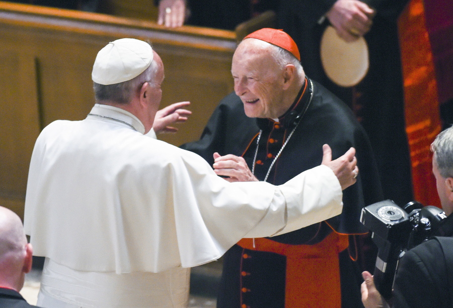 Pope Francis, left, reaches out to hug Cardinal Archbishop emeritus Theodore McCarrick after the Midday Prayer of the Divine in September 2015 at the Cathedral of St. Matthew the Apostle in Washington.