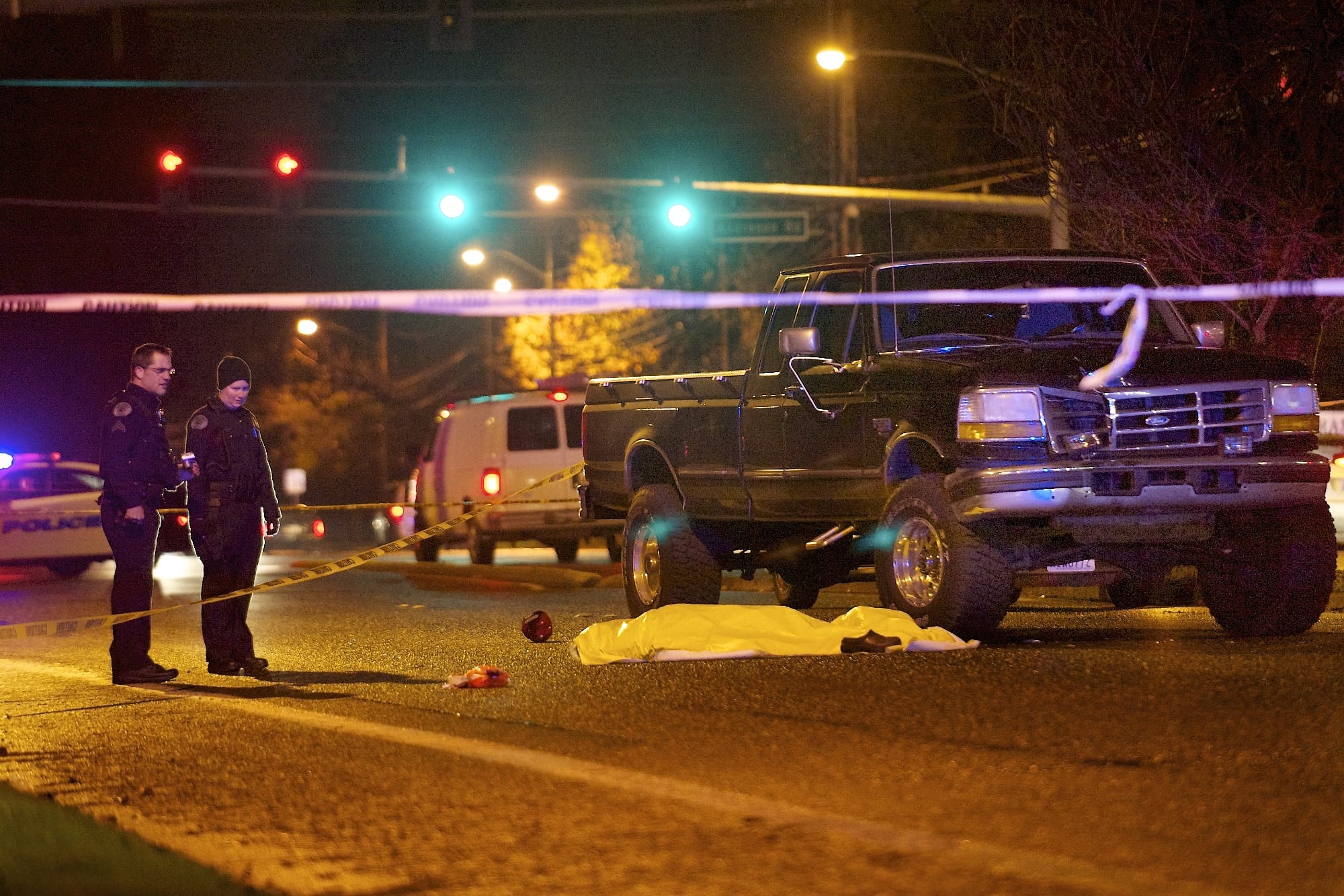 Vancouver police investigate the scene where a pedestrian was struck by an automobile and killed in Vancouver in December 2012.
