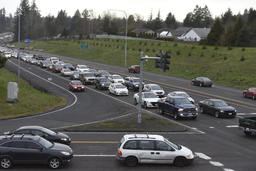 Evening rush hour traffic lines up at the stoplight at the intersection of Highway 500 and Falk Road. Congestion and collisions are a regular feature at the two metered intersections on the highway. WSDOT has released a plan to correct the congestion, possibility as early as this fall.