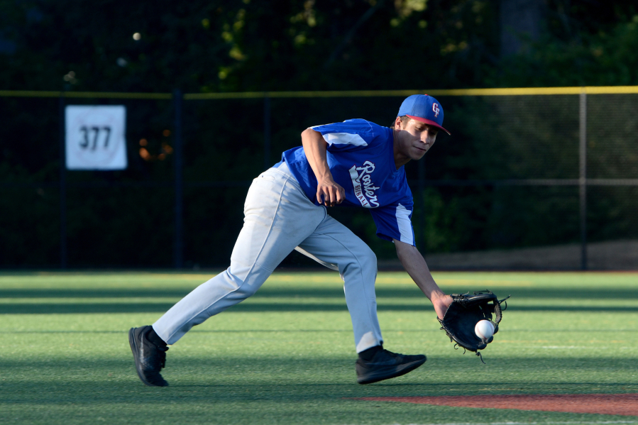 Irving Alvarez, 15, scoops up a grounder during a KWRL Centerfield Roosters U15 baseball team practice at Luke Jensen Park in Vancouver on Friday, August 3, 2018. The Roosters are preparing to compete in the 15U Babe Ruth World Series played Aug. 9-16 in Longview, Wash.