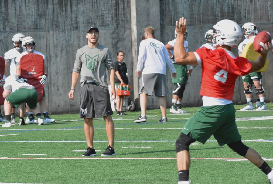 Linebackers coach Parker Henry barks out instructions to the defense during a practice last week at Portland State.