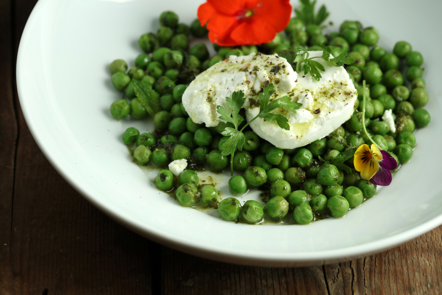 A plate of fresh peas and goat cheese provides simple, easy pleasure. (E.