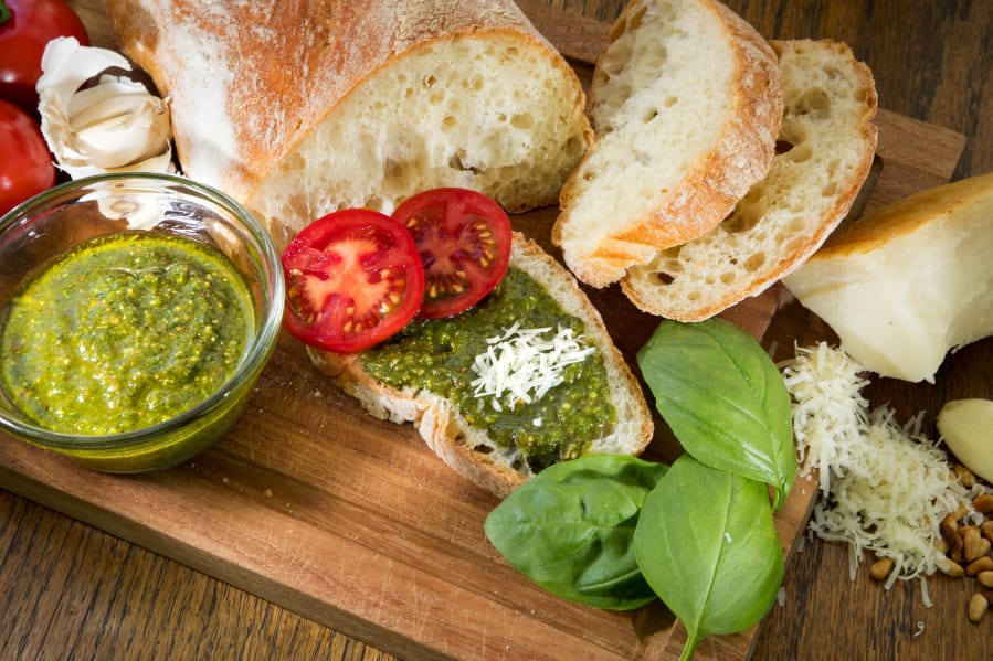 Fresh basil, pine nuts, garlic and olive oil are the main ingredients in fresh pesto.