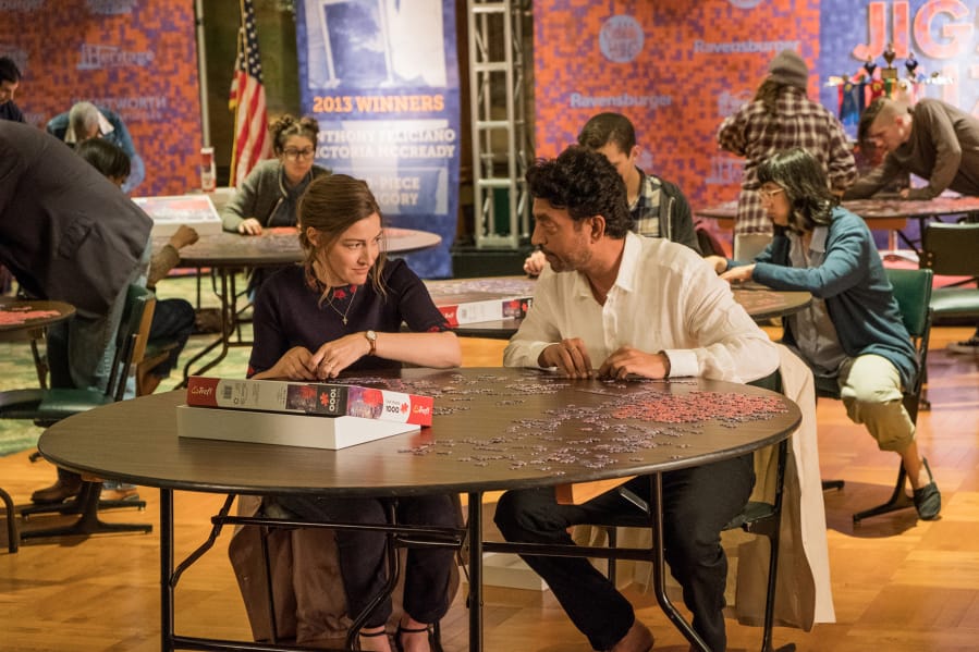 Kelly Macdonald and Irrfan Khan portray partners in a jigsaw-puzzling competition.