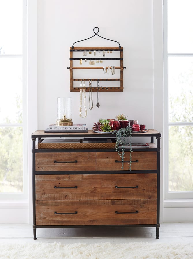 Show off your earrings and necklaces, even when you’re not wearing them, with a space-saving, wall-mounted hanger. Shown, Pottery Barn’s pine and iron wall-mounted jewelry hanger, $99.