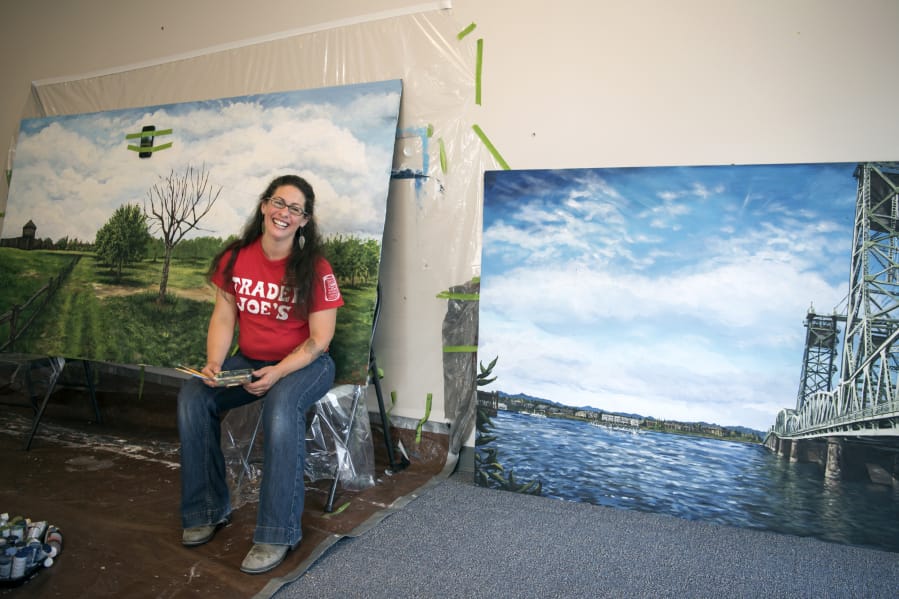 Trader Joe’s artist Crystal Humble Lary of Vancouver works on a mural of the Fort Vancouver apple orchard at a workspace near the Vancouver Trader Joe’s. Humble Lary paints murals for the store that focus on community landmarks and spaces around the Vancouver area.