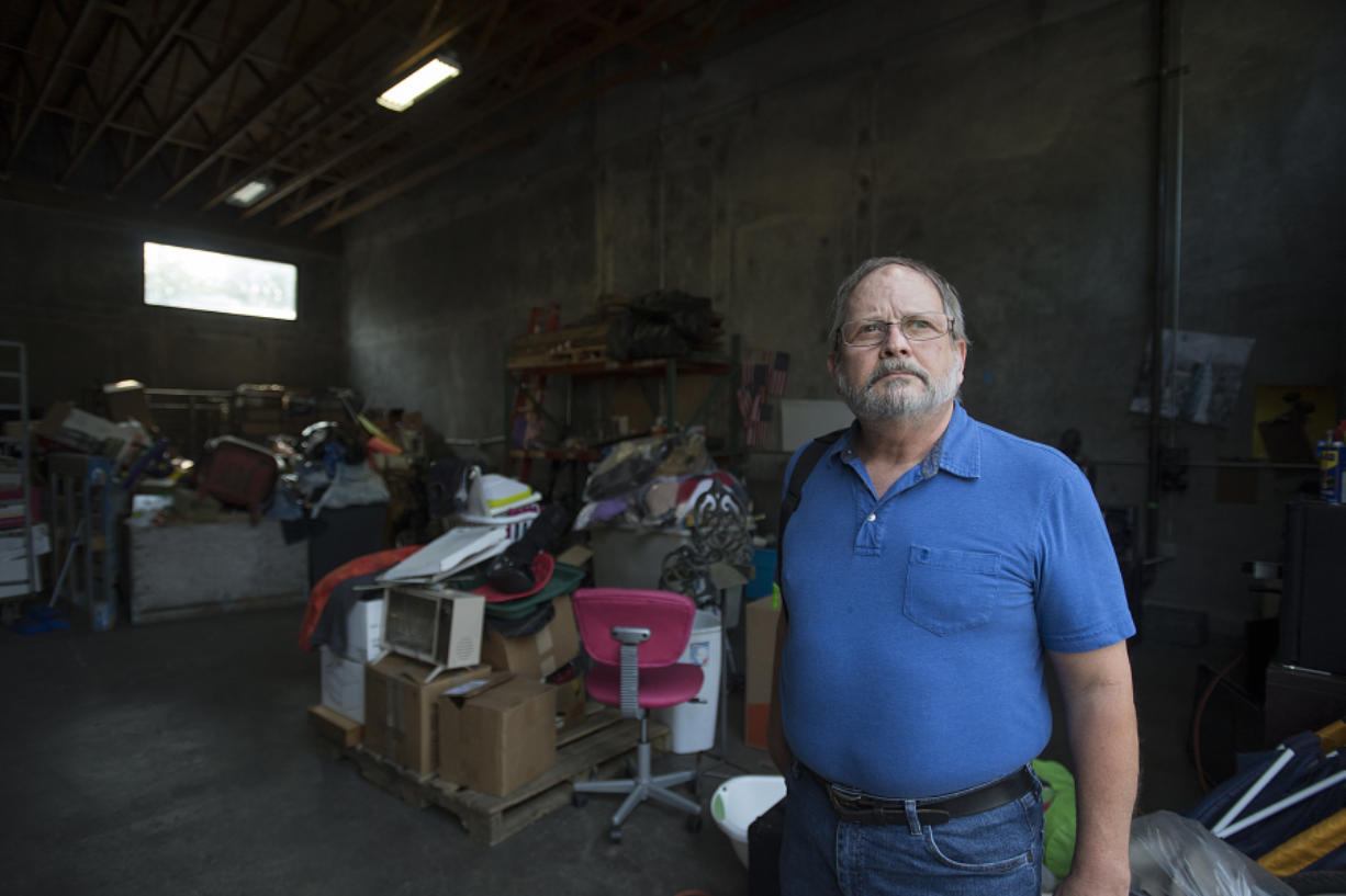 John Weber, the interim executive director of the Arc of Southwest Washington, looks over the nonprofit’s warehouse that stores donated goods. The nonprofit, which assists people with developmental and intellectual disabilities, has struggled financially for several years.