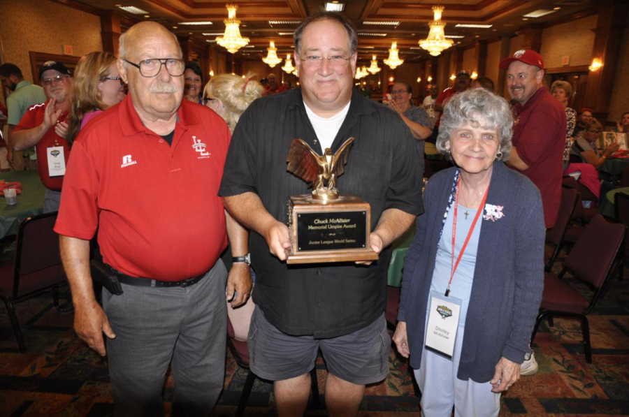 Riveridge: George Glick, director of umpires for the Junior League Baseball World Series, left, presents the Chuck McAllister Umpire Award to Joe Loftgren of Vancouver, center, along with Shirley McAllister, Chuck McAllister’s widow.