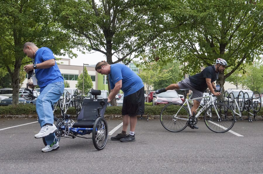 Army veteran Ben Jury of Oahu, Hawaii, from left, Adaptive Bike Specialist Dane Honyman and Army veteran Luis Sanchez of Steilacoom test their bikes in Vancouver in preparation for two bike rides through Wounded Warrior Project that are offered to help heal emotional, physical and mental injuries sustained in military service.
