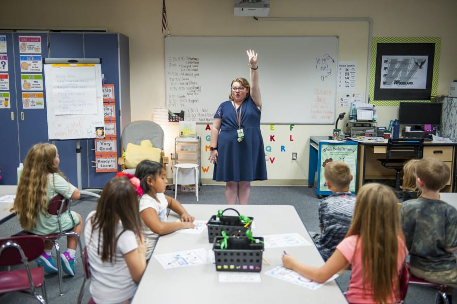 Second-grade teacher Jazmin Rebstock calls for her students’ attention on the first day of school at Woodland Intermediate School. With teacher strikes in the Evergreen and Washougal districts, Woodland was the only school district to open Tuesday in Clark County.