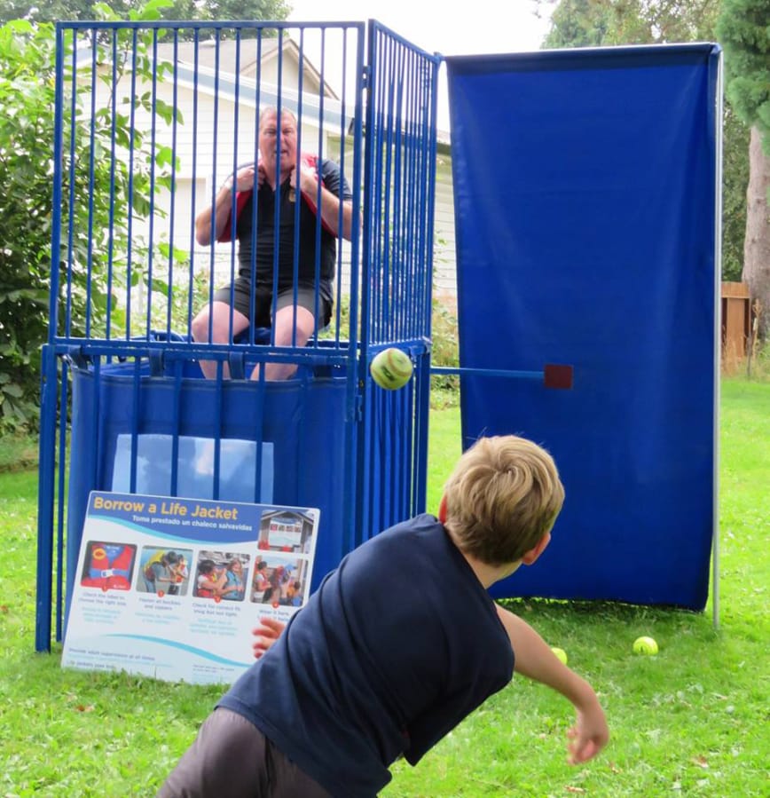 Woodland: Woodland Police Chief James Kelly sits in the dunk tank at the Friends of the Woodland Community Library’s second Bocce Ball Blowout tournament to raise funds for a new library building.