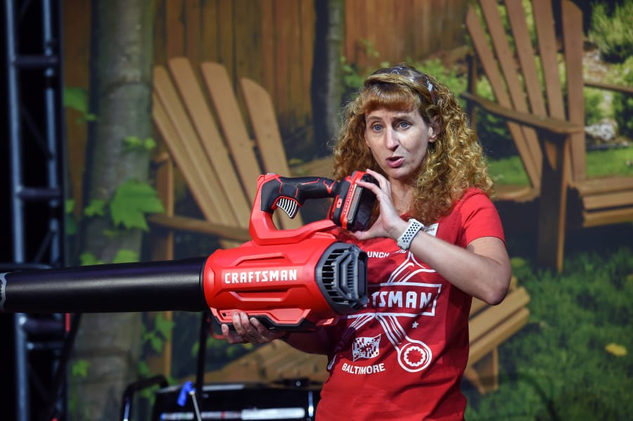 Christine Potter, vice president of outdoor power equipment, talks Thursday about the Craftsman blower and the battery system that powers many of its tools.