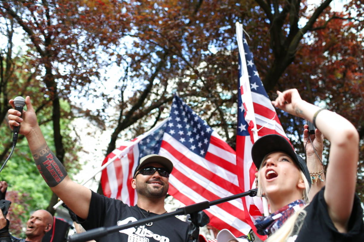 Joey Gibson, left, leader of Patriot Prayer, heads the group's rally in Portland in June. Portland is bracing for what could be another round of violent clashes Saturday, Aug. 4, 2018, between a right-wing group holding a rally here and self-described anti-fascist counter-protesters who have pledged to keep Patriot Prayer and other affiliated groups out of this ultra-liberal city.