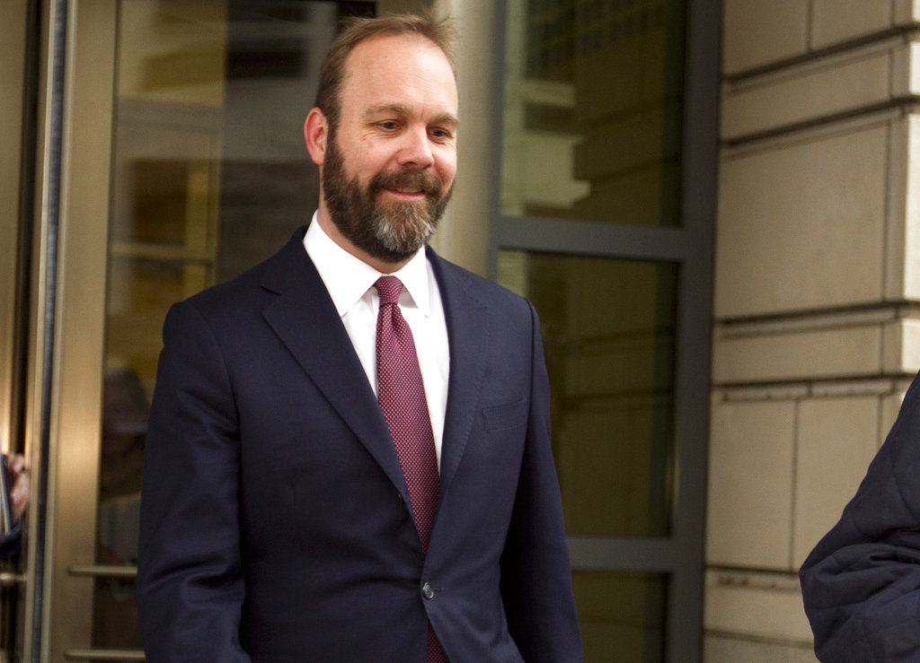 FILE - In this Feb. 23, 2018, file photo, Rick Gates leaves federal court in Washington. Paul Manafort’s trial opened this week with a display of his opulent lifestyle and testimony about what prosecutors say were years of financial deception.